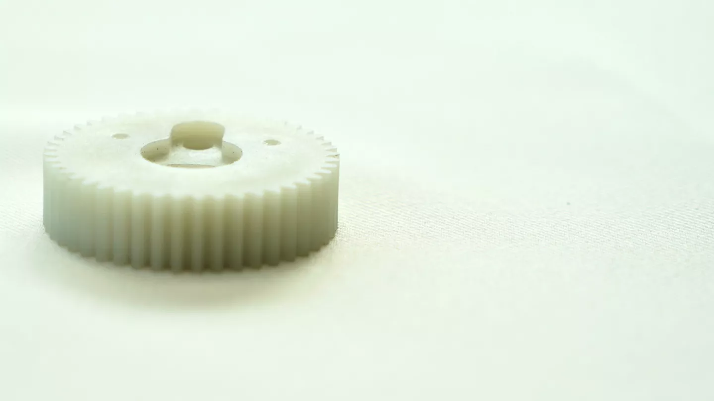 In several customer cases involving gears, cam followers, and sliding blocks, POM operated smoothly at the beginning but later exhibited wear, creep, or dimensional drift once thermal or mechanical stress accumulated. Under these conditions, glass fiber reinforced PA6 or PA66 provided more consistent long-term performance, offering higher stiffness and improved heat resistance while still maintaining acceptable sliding performance with appropriate design considerations.